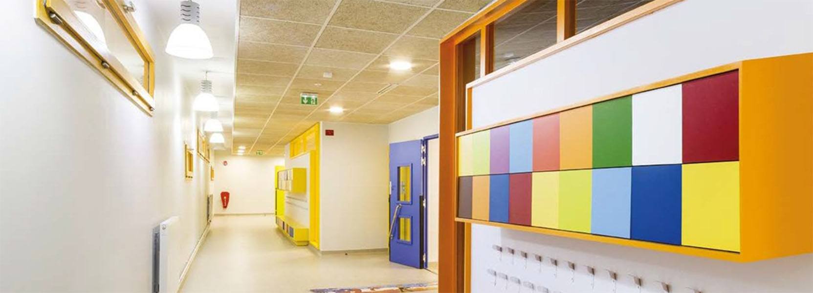 Organic Panels Installed Into a Modular Ceiling in a School Corridor