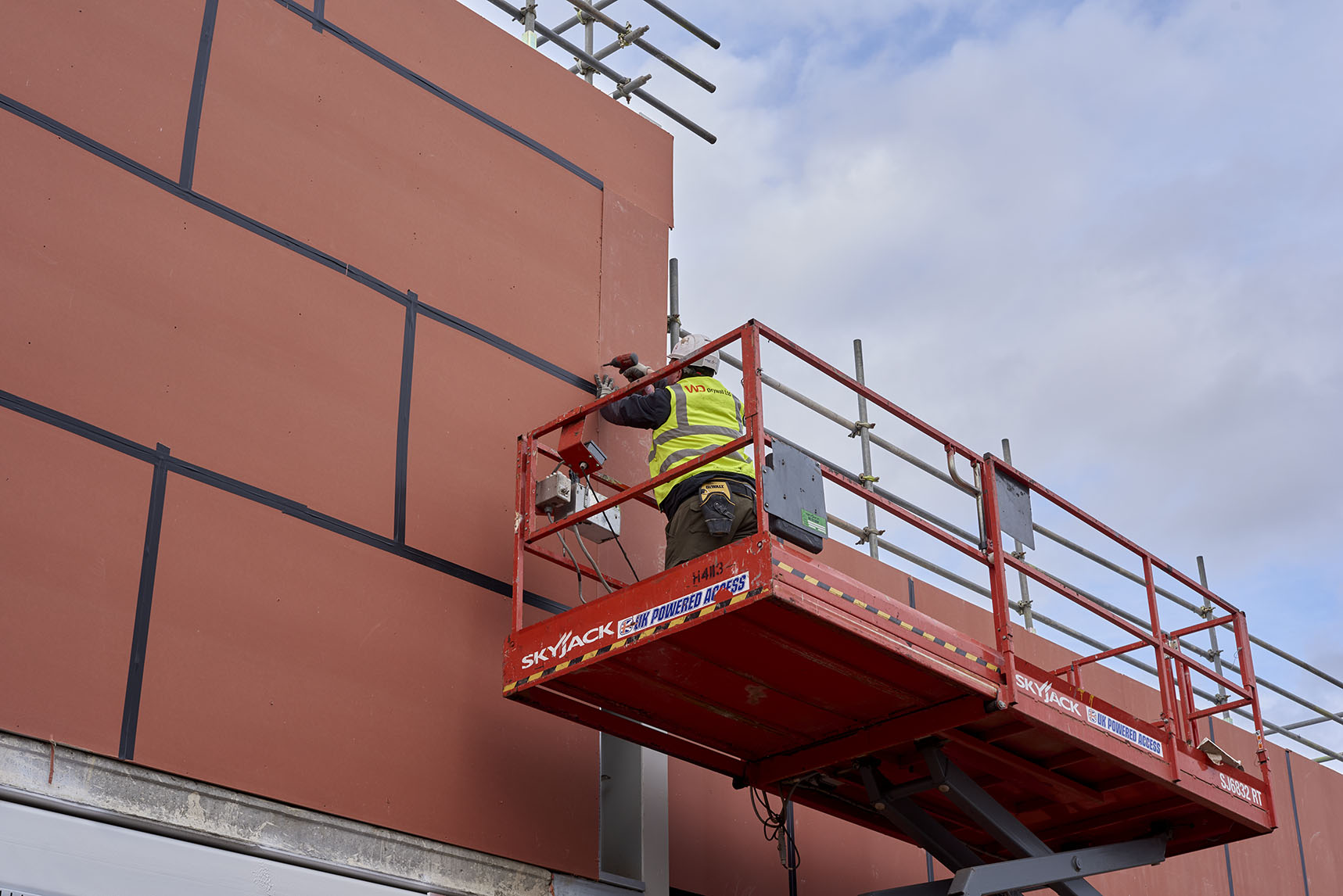 Contractor Fixing Knauf Windliner Boards As External Sheathing Board