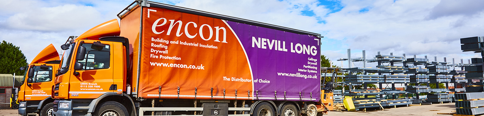 Encon and Nevill Long delivery trucks in branch yard
