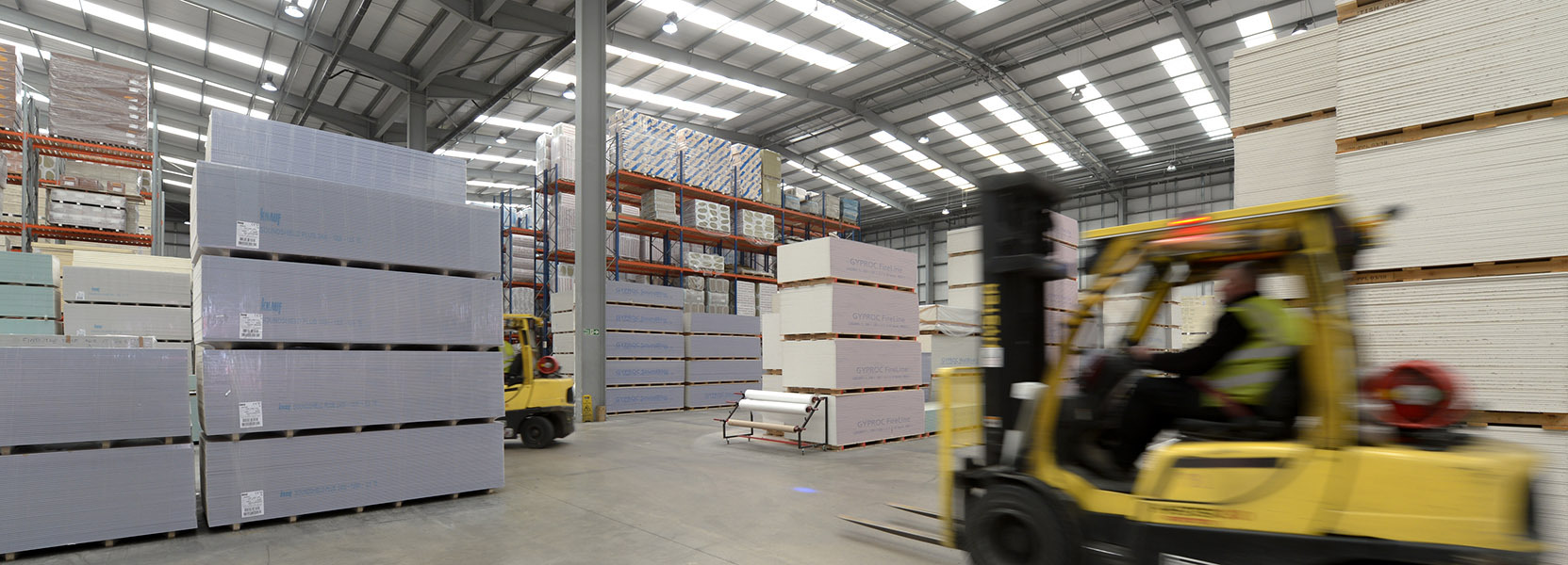 Forklifts working in a warehouse