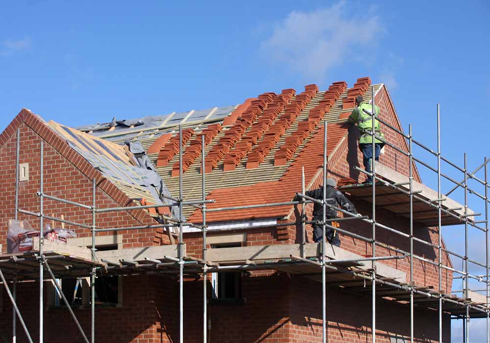 Builders working on a house extension project