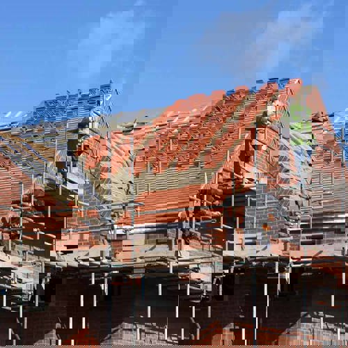 Builders working on a house extension project