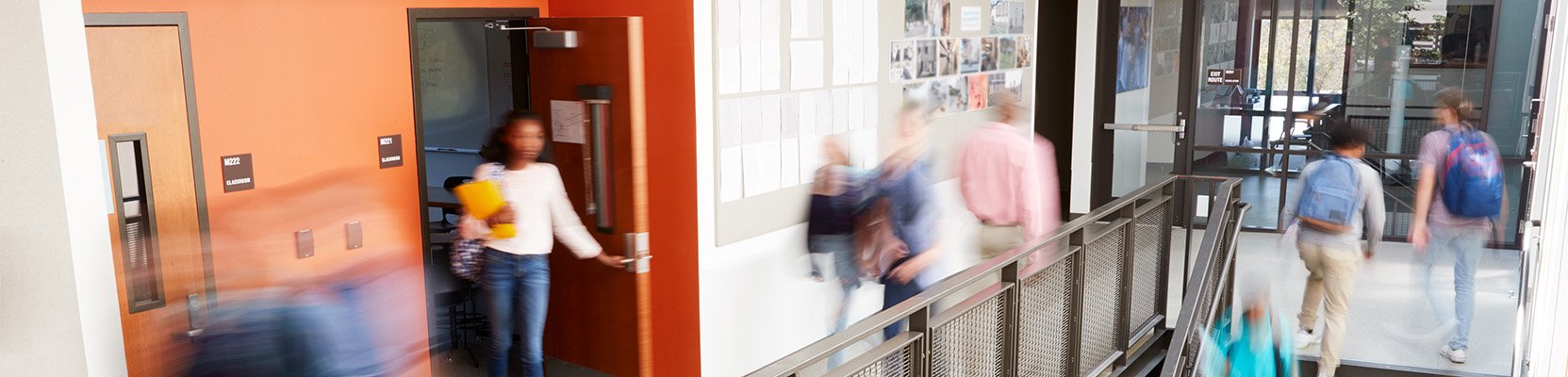 Pupils moving around a school corridor