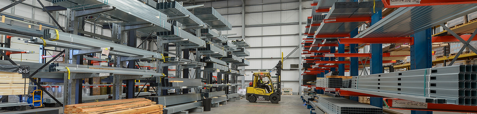 Drywall metal sections stored in a warehouse bay